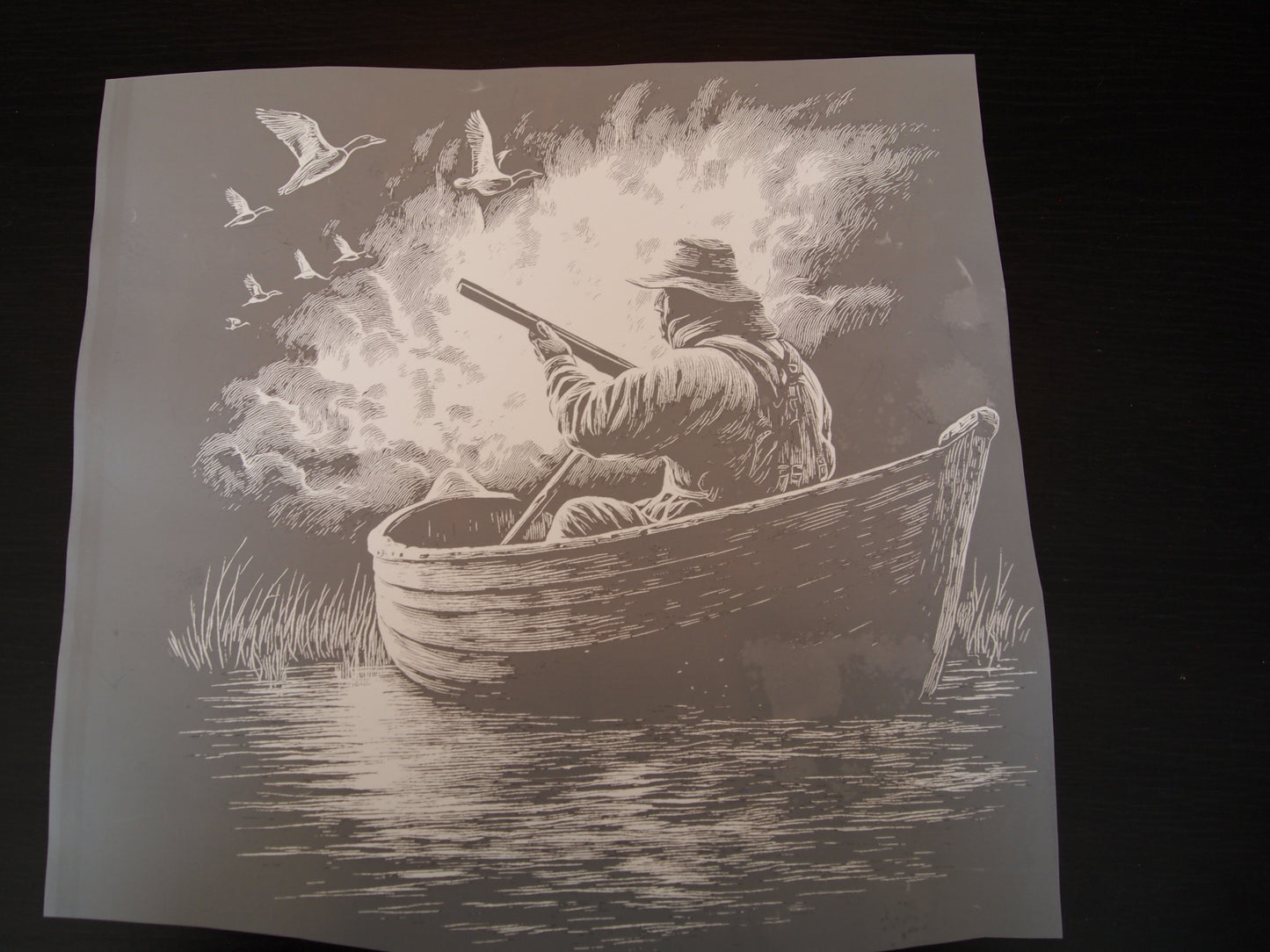 Black out hunter in boat/birds